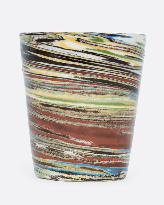  A ceramic Nerikomi cup with multicolored swirls. Shown from the front.