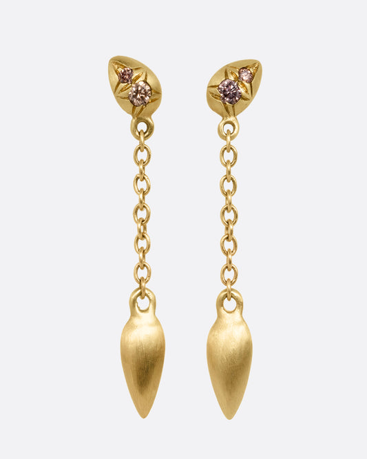 Yellow gold earrings with brown diamonds and cable chain drops. Shown from the front.