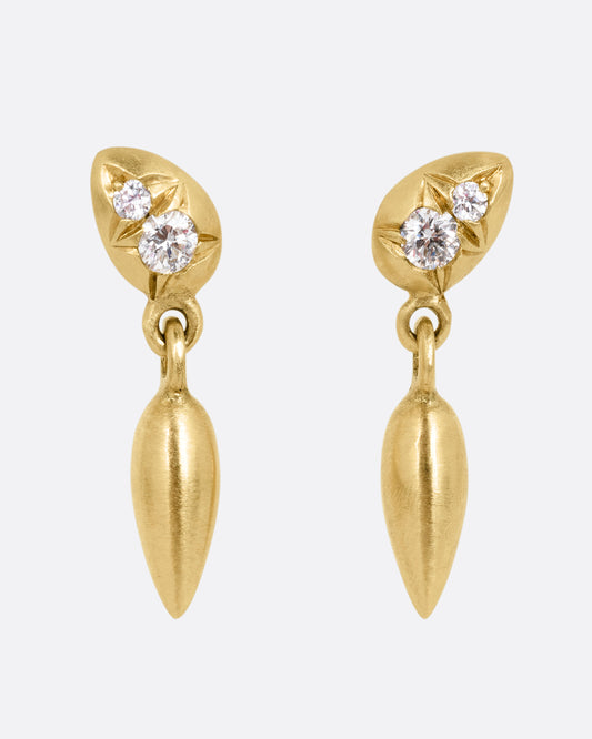 Yellow gold diamond earrings with teardrop shaped dangles. Shown from the front.