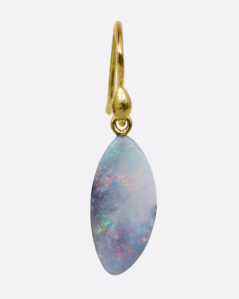 A single wing shaped opal with a yellow gold ear hook. Shown from the front.