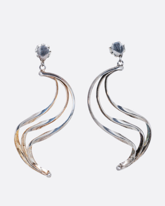 Silver dangle earrings with stud tops and three layers of silver ribbons in an S shape. Shown from the front.
