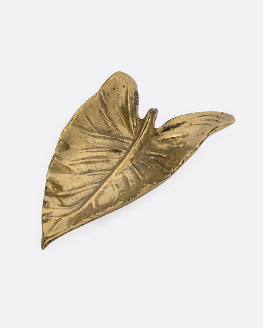 A brass calla lily leaf shaped dish, shown from the top.