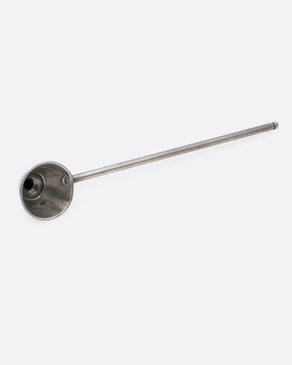 A silver candle snuffer shown from the bottom.