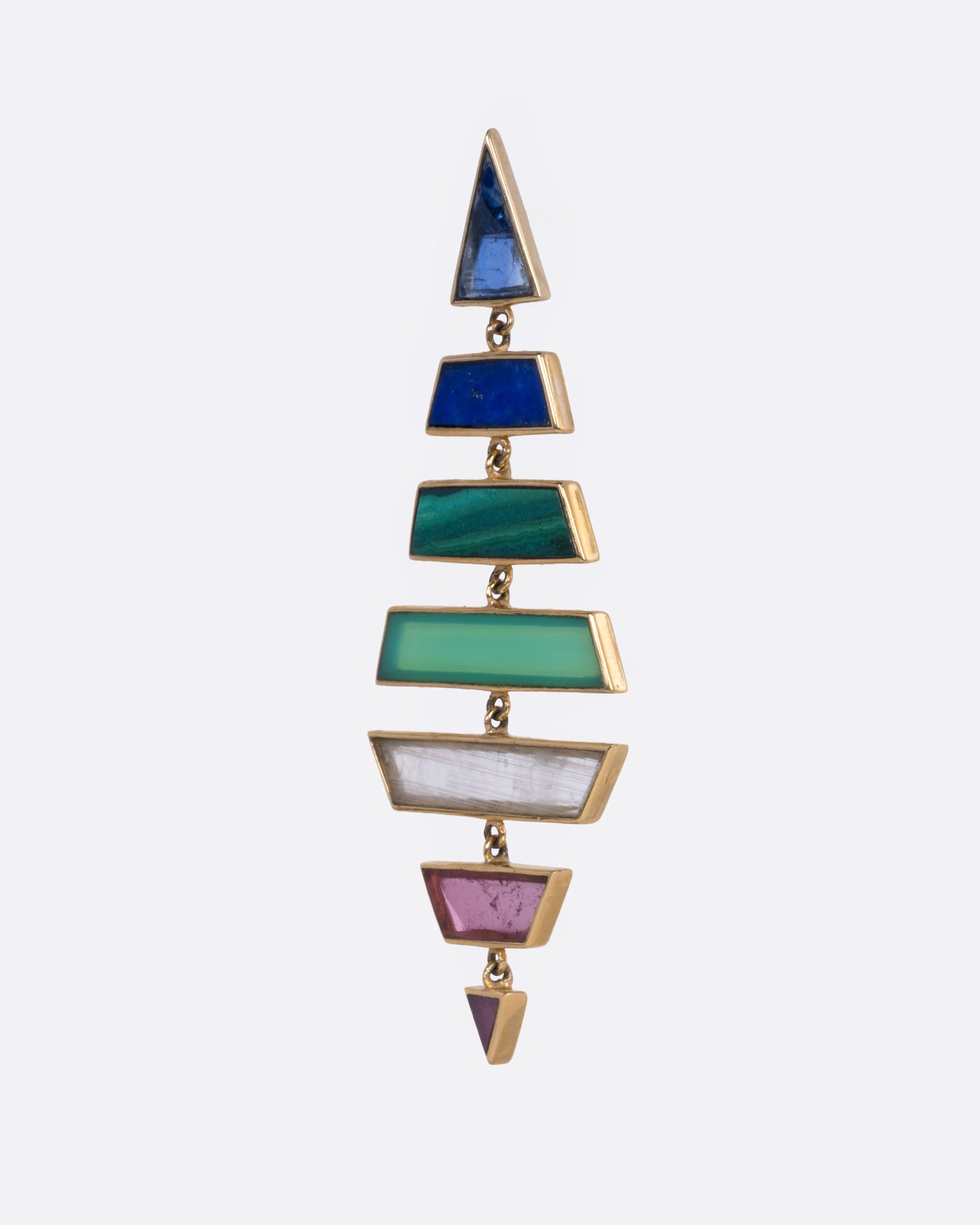 A yellow gold kite shaped drop earring with multi-colored hand cut stones, shown from the side.