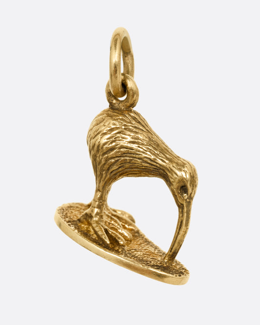 A yellow gold kiwi bird pendant. Shown from the front.