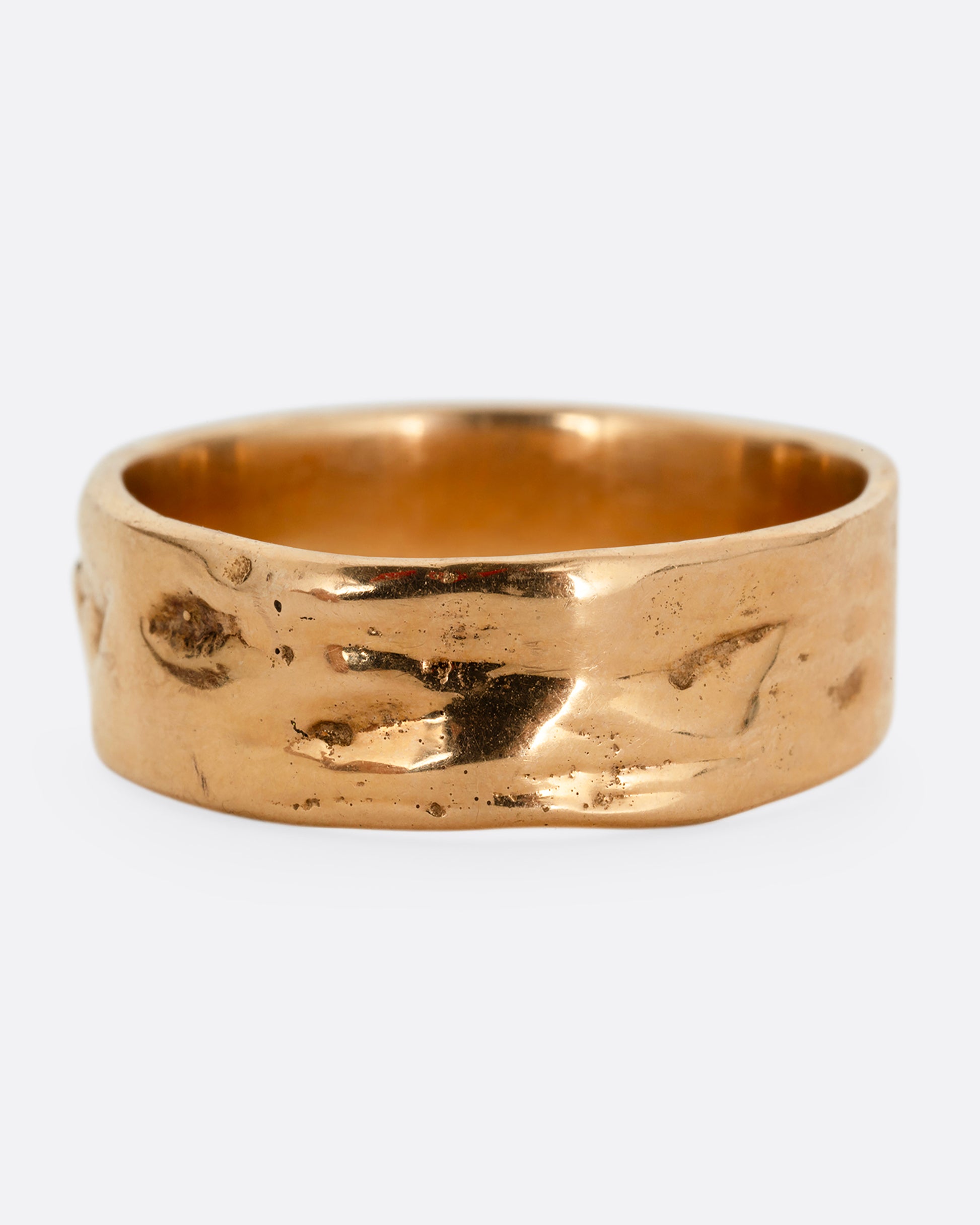 A rose gold band with a textured and polished finish. Shown from the front.