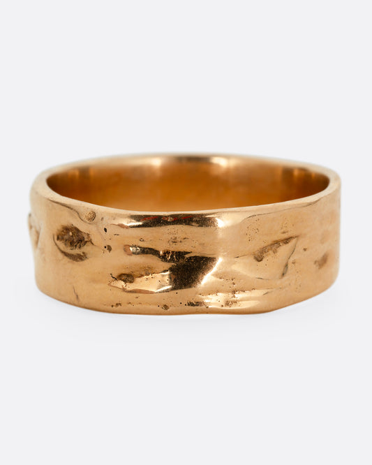 A rose gold band with a textured and polished finish. Shown from the front.