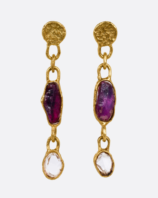 A pair of yellow gold earrings with sapphires and diamonds, shown from the front.
