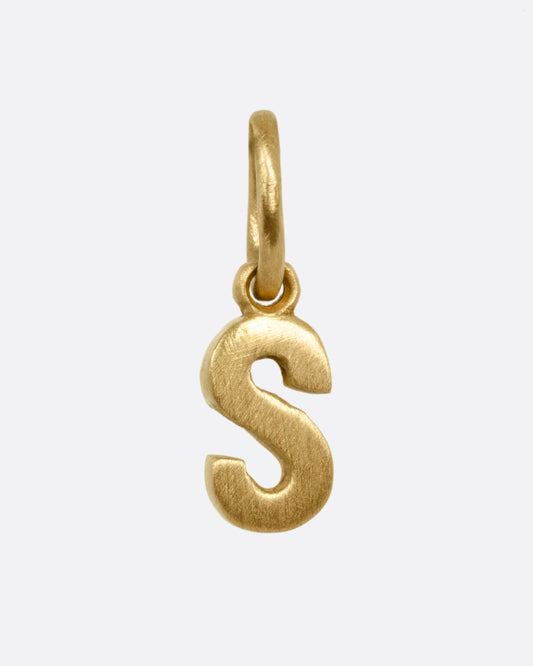 A yellow gold letter 'S' pendant shown from the front.