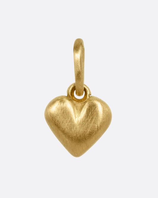 A yellow gold heart-shaped pendant shown from the front.