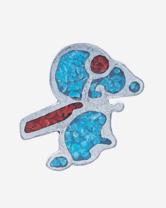 A silver snoopy charm with turquoise and coral chips inlay. Shown from the front.