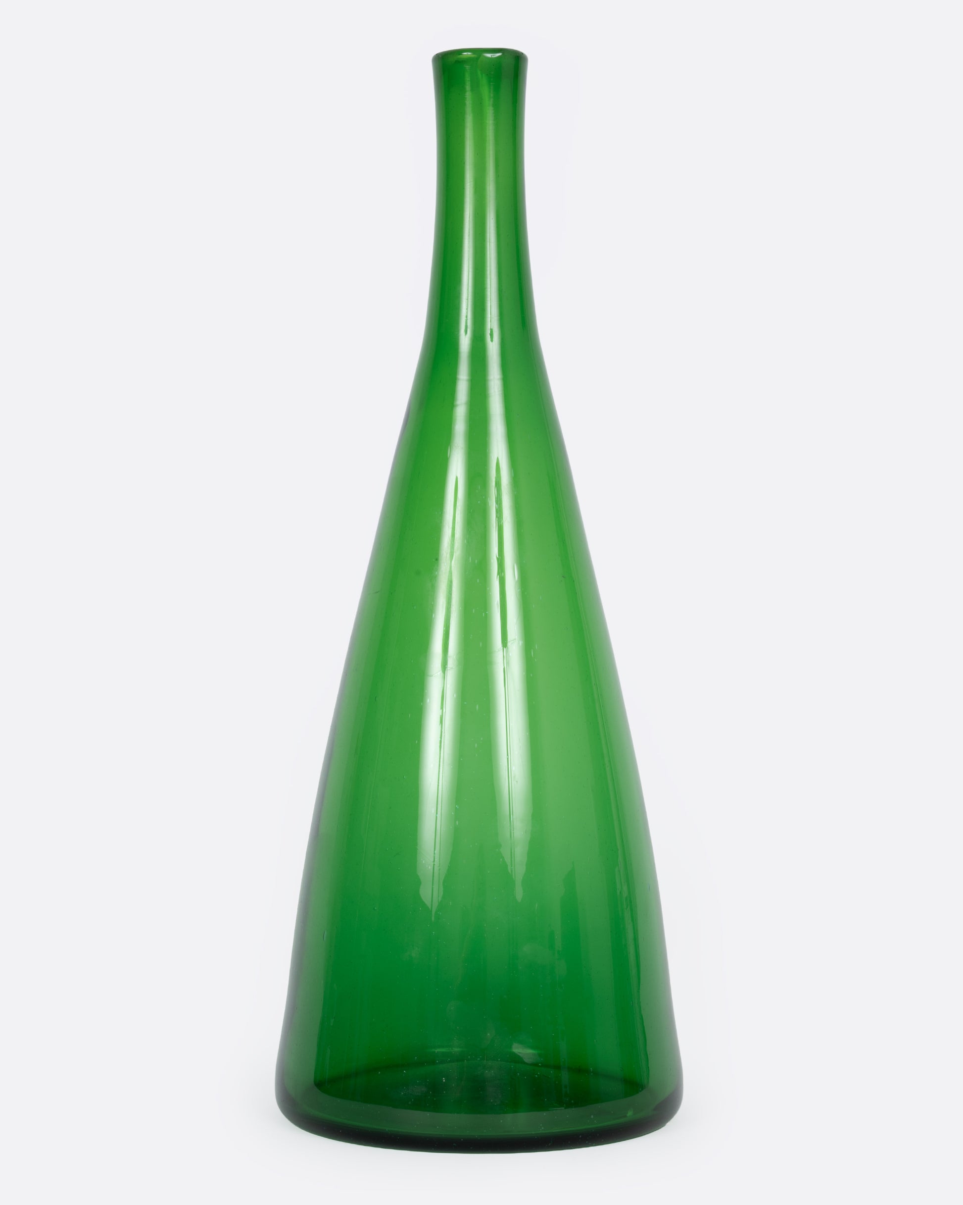 A tall tapered green glass vase, shown from the front.