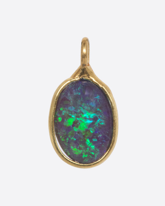 An Australian opal dangle set in yellow gold. Shown from the front.