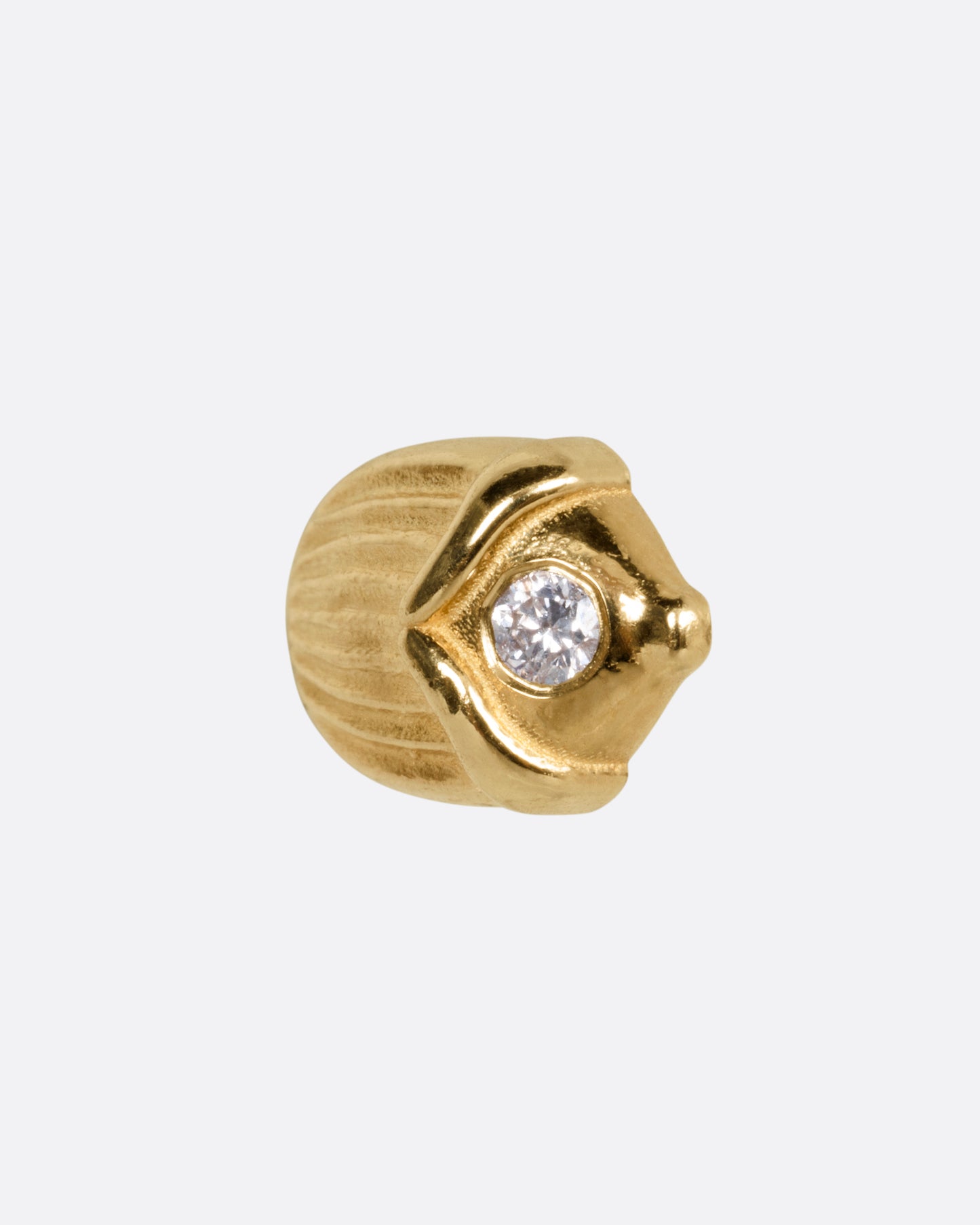 A  yellow gold scarab shaped stud earring punctuated by a diamond, shown from the side.