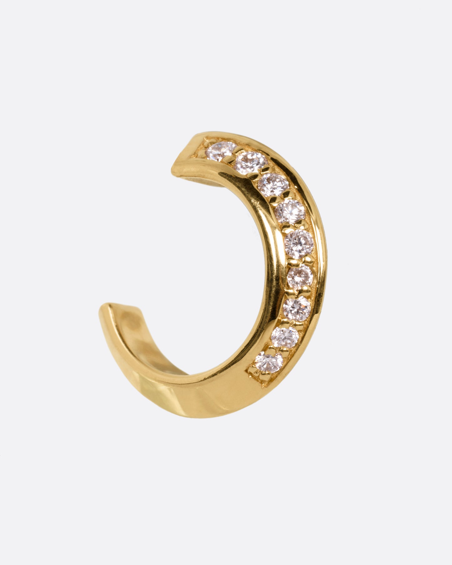 A yellow gold hoop earring with diamonds, shown from the side.
