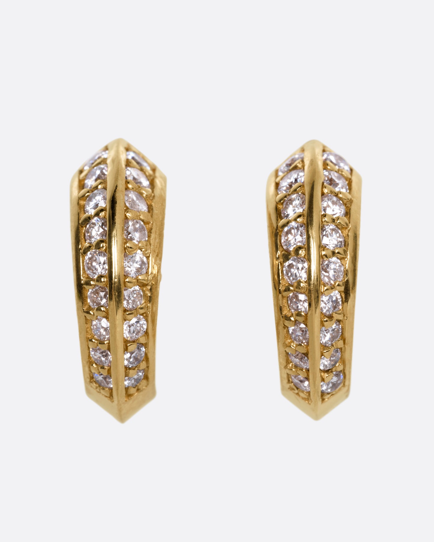 A pair of yellow gold hoop earrings with diamonds, shown from the front.