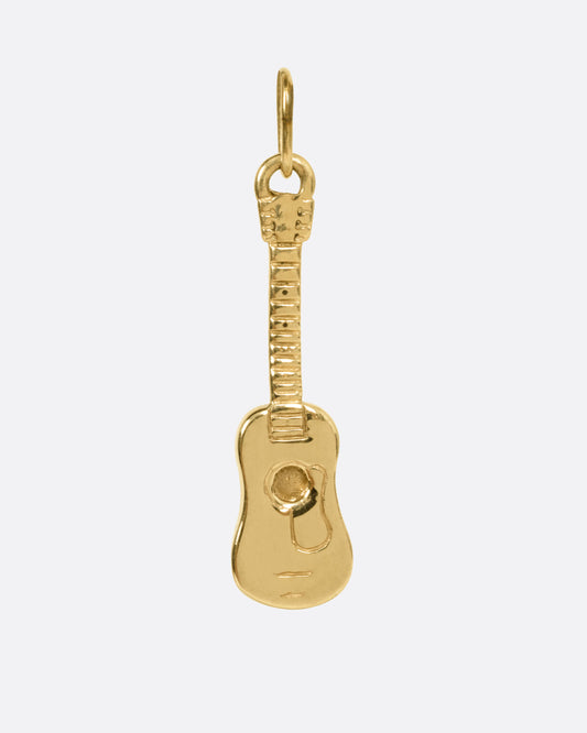 A yellow gold guitar charm, shown from the front.