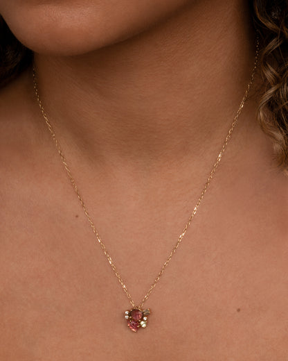 Yellow gold watermelon tourmaline cluster pendant worn on a fine chain
