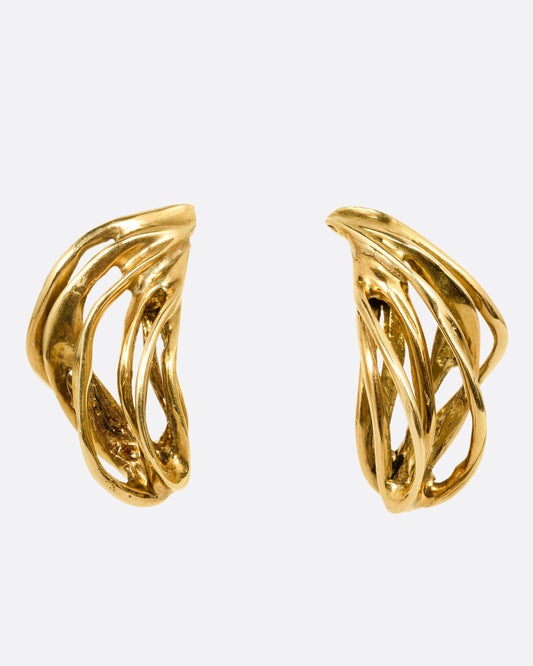 A pair of yellow gold stud earrings with clusters of  intertwined gold strands. Shown from the front.
