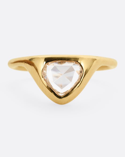 A yellow gold ring with a triangular rose cut diamond. Shown from the front.