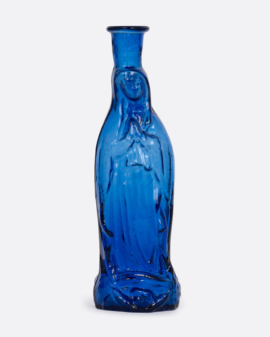 A blue glass vase with a praying Madonna. Shown from the front.