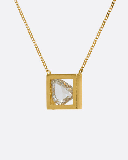 Yellow gold diamond slice necklace, front view of the open square frame and the diamond inside