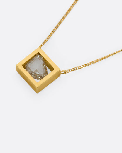 Yellow gold diamond slice necklace, angled view of the frame and the rose-cut diamond
