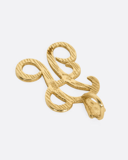 A yellow gold 'A' charm, shown from the back.