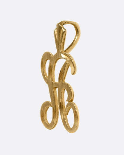 A yellow gold 'A' charm, shown from the side.