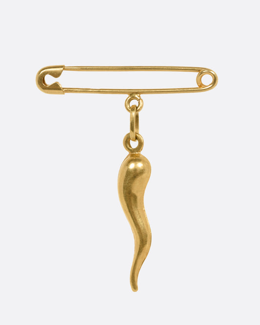 A yellow gold safety pin charm with an Italian horn dangle, shown from the front.