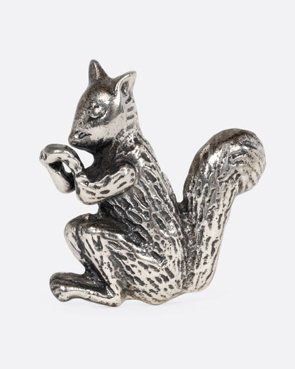 A silver squirrel pin, shown from the front.