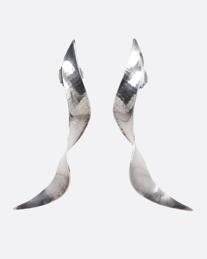 A pair of silver twisty earrings with a hammered finish, shown from the front.