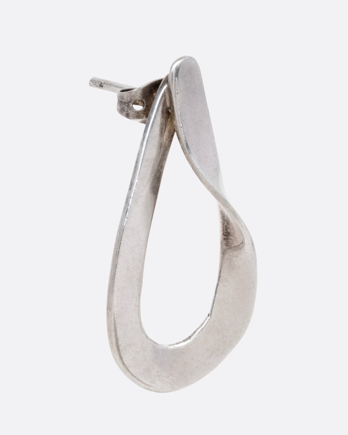 A silver twisted dimensional drop stud, shown from the side.