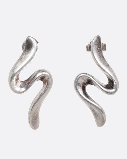 A pair of silver wavy stud earrings shown from the front.