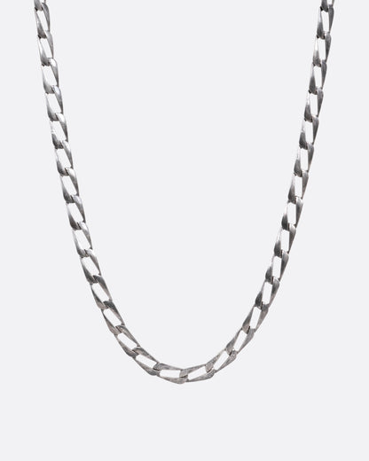 A silver chain with elongated oval links, shown from the front.