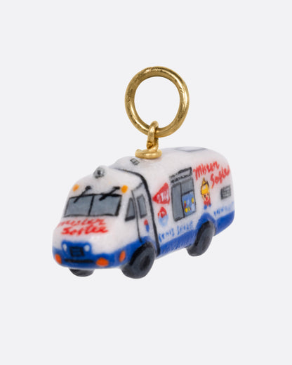 A porcelain 'Mister Softee' charm with a yellow gold bail, shown from the side.