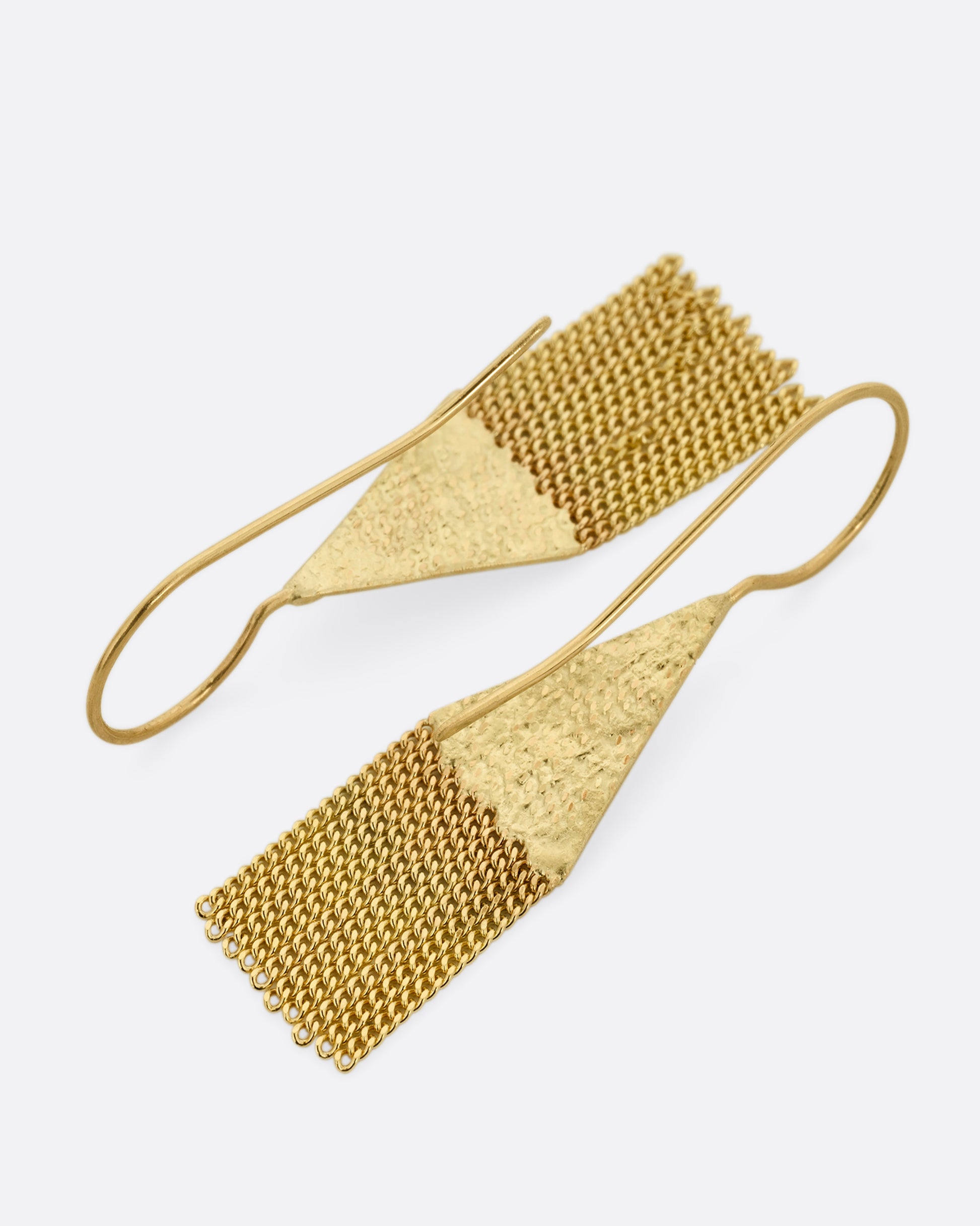 A pair of yellow gold drop earrings with diamond shaped tops and cable chain fringe bottoms. Shown from the back.