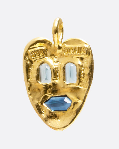 Yellow gold heart face pendant with aquamarine and sapphire, back of the pendant showing the 22k and Oraik stamps
