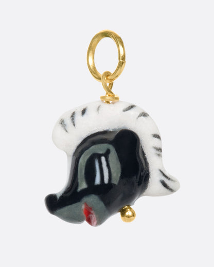 Porcelain skunk head charm, other side view
