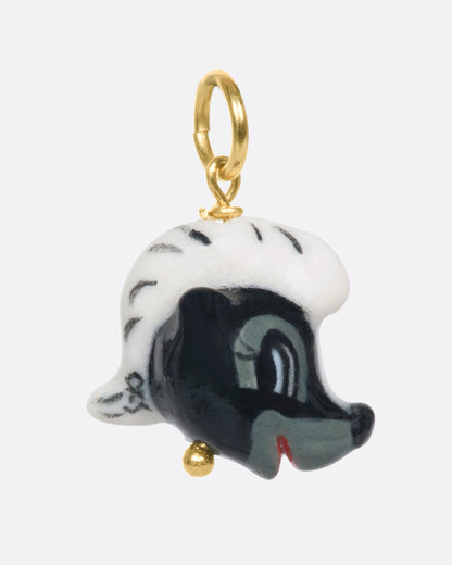 Porcelain skunk head charm, angled view