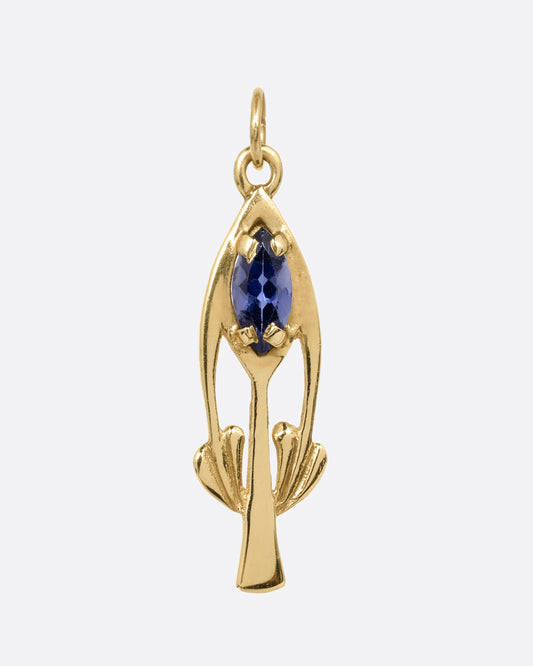A yellow gold pendant in a flower shape with a marquis amethyst. Shown from the front.