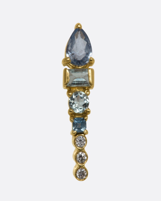 A long stud earring with an aquamarine, tanzanite, apatite, and three round diamonds stacked. Shown from the front.