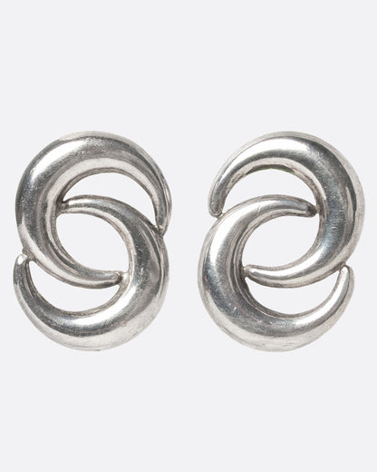 A pair of Norwegian silver earrings with two layered crescent moons, shown from the front.
