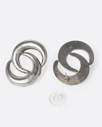 A pair of Norwegian silver earrings with two layered crescent moons. One earring is shown from the front, the other open from the back.