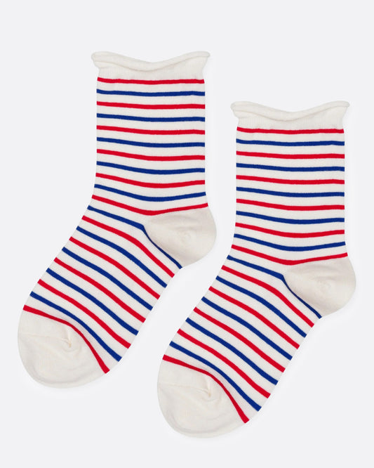 A pair of crew socks with horizontal red, blue, and white stripes and white toes, heels, and cuff. Shown from the side.