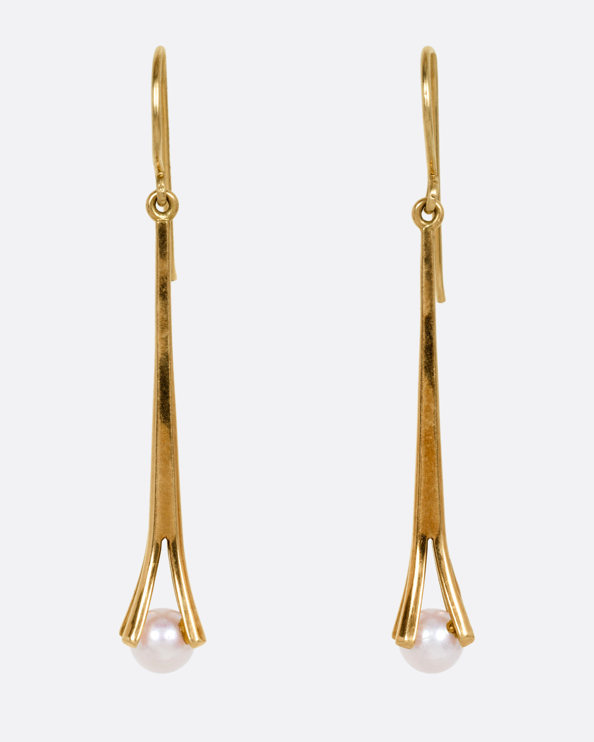A pair of yellow gold drop earrings with a split vertical bar, and a single white pearl hanging from the bottom, shown from the front.
