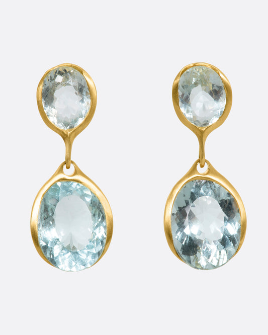 A pair of yellow gold aquamarine stud double drop earrings. View from the front.