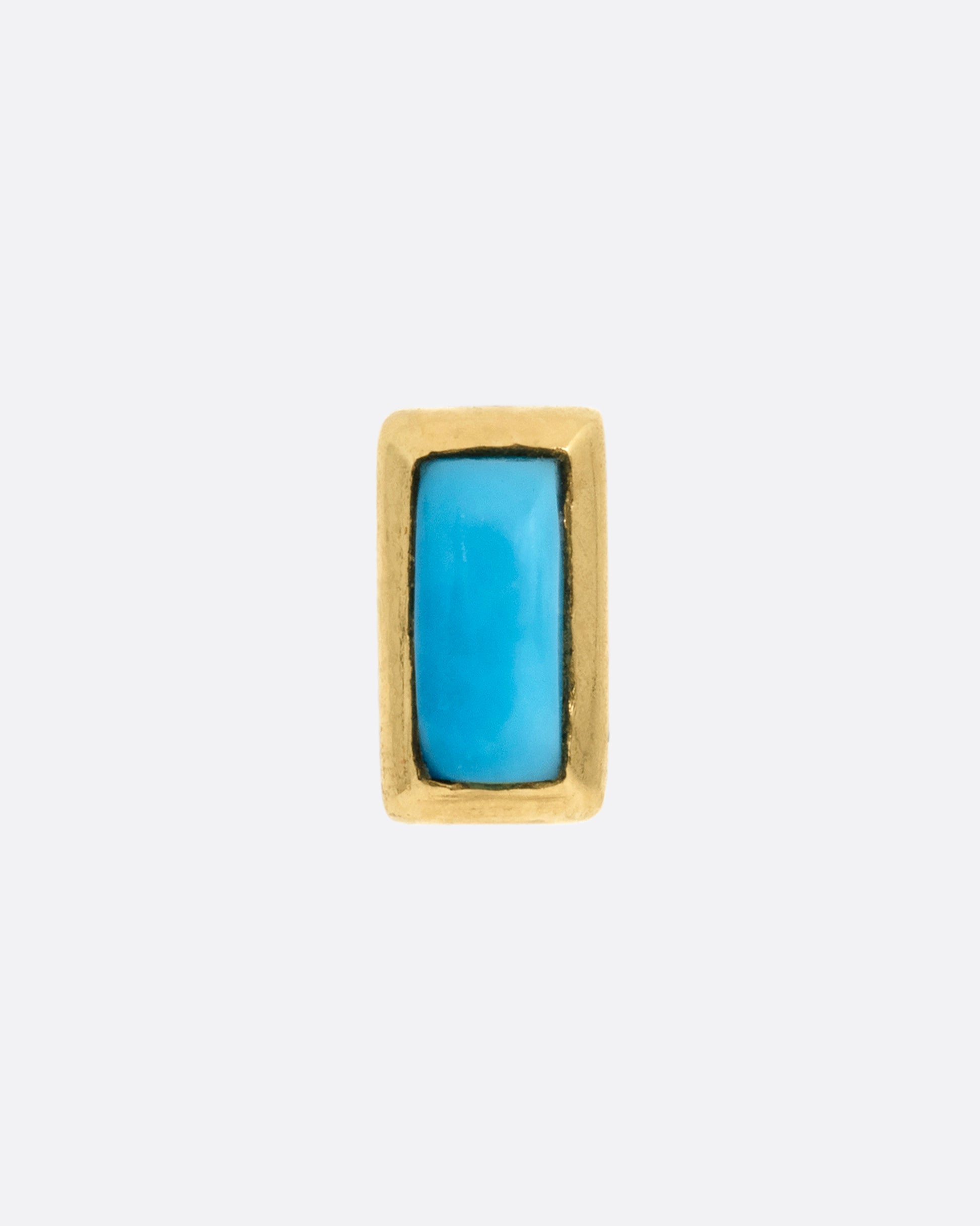 A yellow gold stud earring with a baguette cut turquoise, shown from the front.
