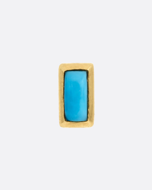A yellow gold stud earring with a baguette cut turquoise, shown from the front.