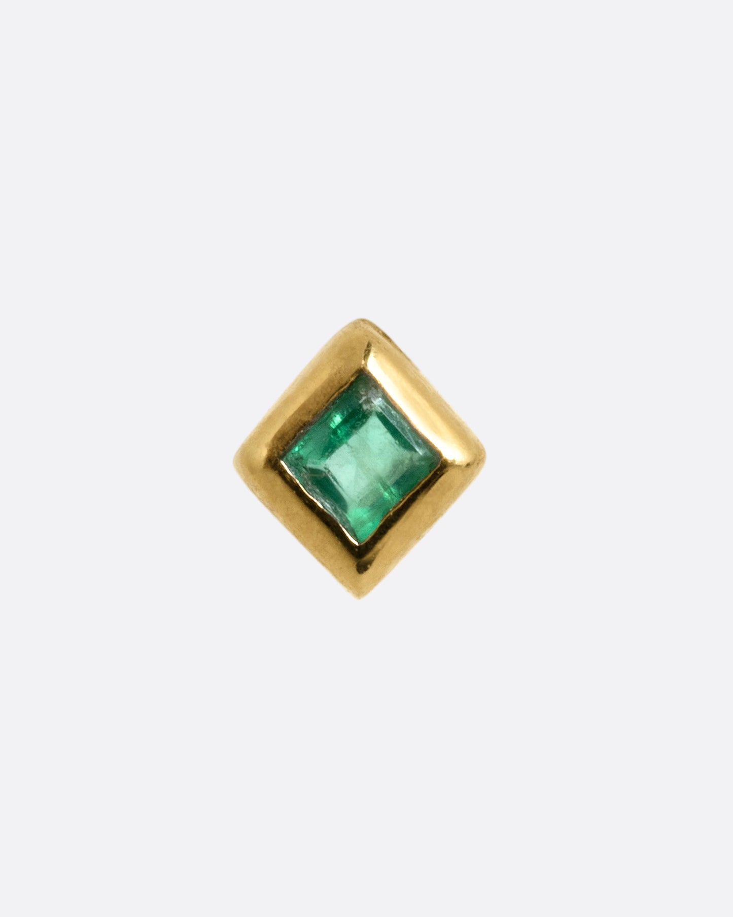 A yellow gold stud earring with a princess cut emerald, shown from the front.